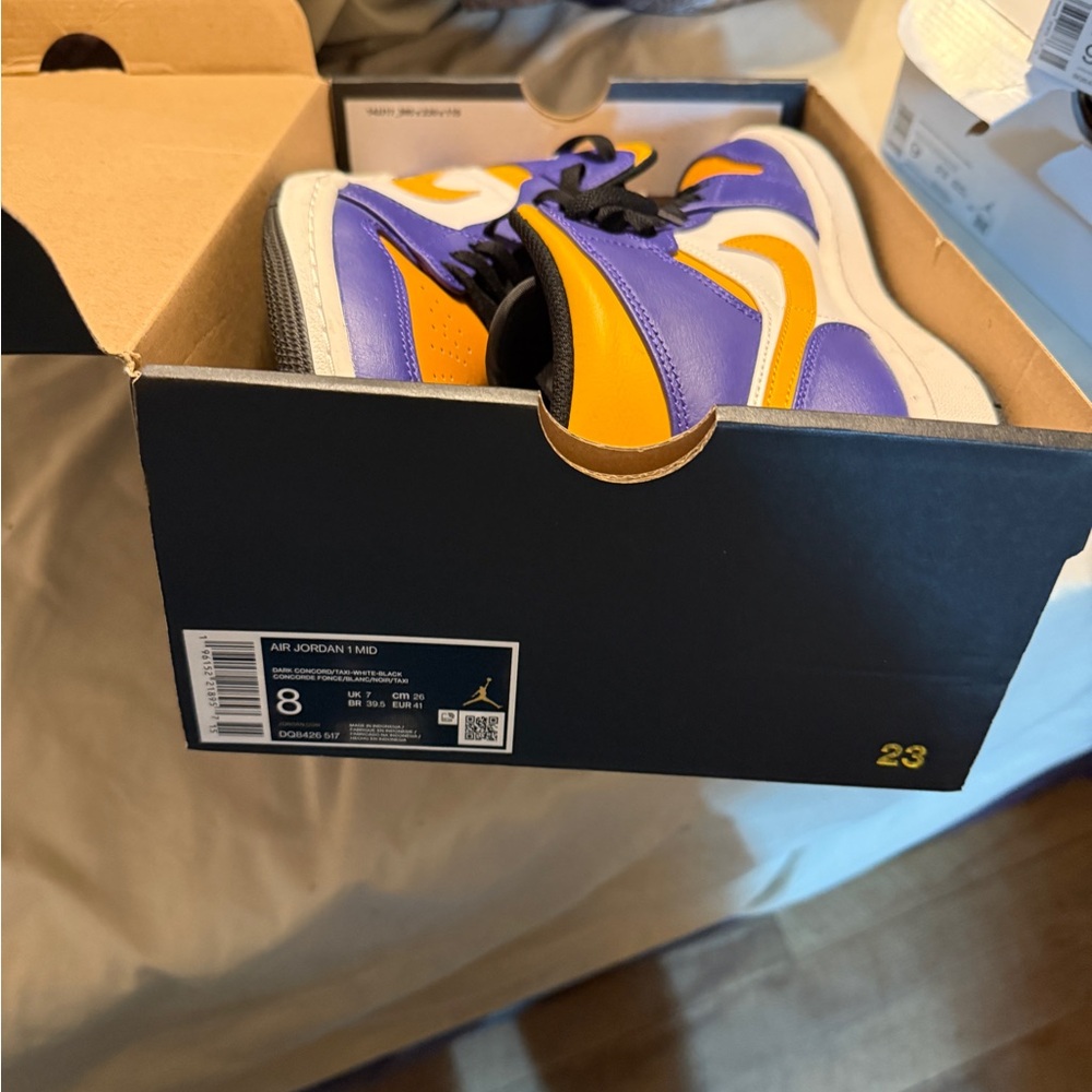 Nike Air Jordan Mid Purple and Orange Athletic Shoes